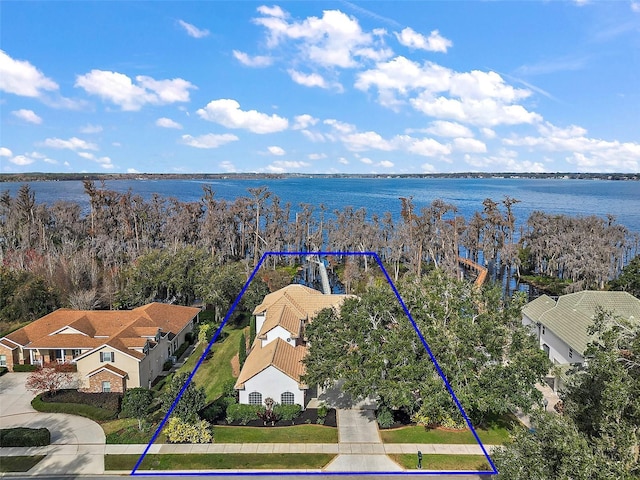 birds eye view of property featuring a water view