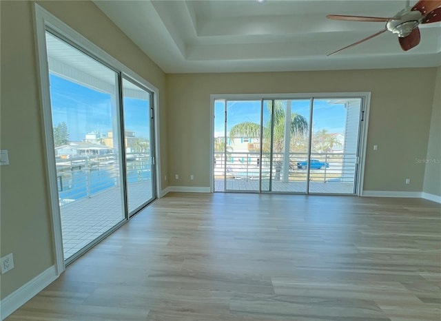 spare room with ceiling fan and light hardwood / wood-style floors