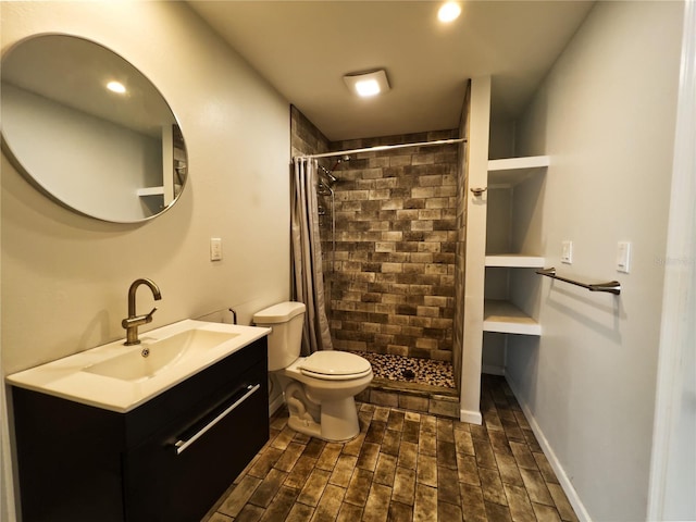 bathroom featuring vanity, curtained shower, and toilet