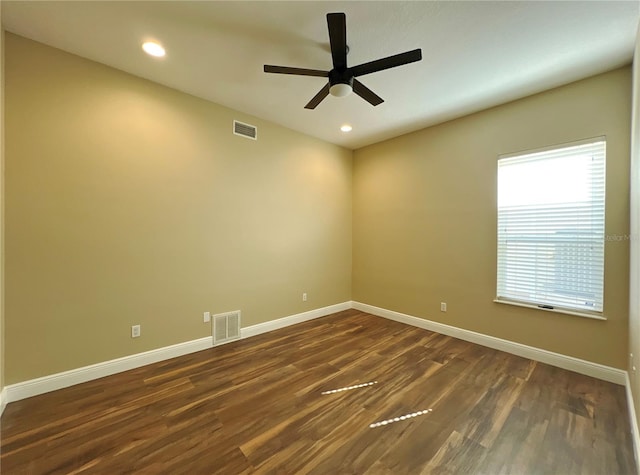 unfurnished room featuring ceiling fan and dark hardwood / wood-style floors