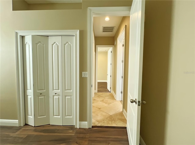 hall with tile patterned flooring