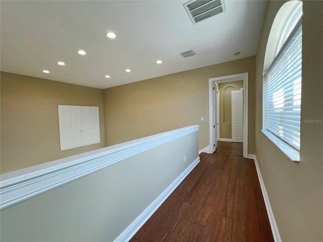 hallway featuring dark hardwood / wood-style flooring