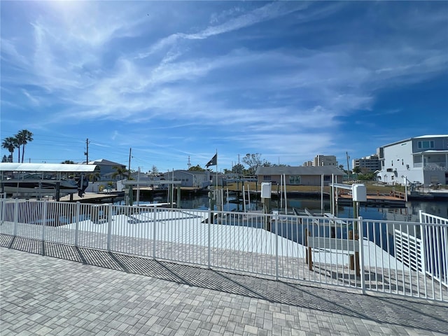 view of front facade with a dock and a water view