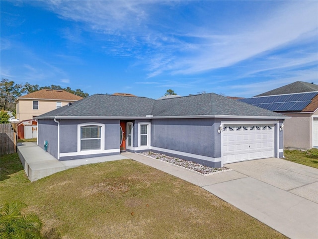 view of front of home with a garage and a front lawn