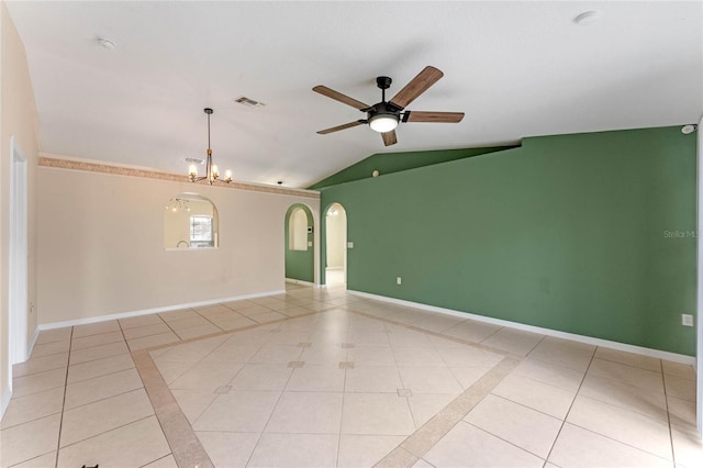 unfurnished room with lofted ceiling, light tile patterned floors, and ceiling fan with notable chandelier