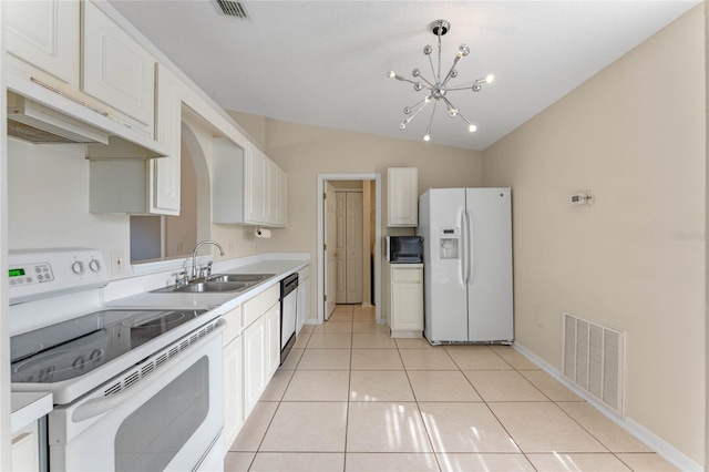 kitchen featuring white cabinetry, sink, light tile patterned floors, and stainless steel appliances