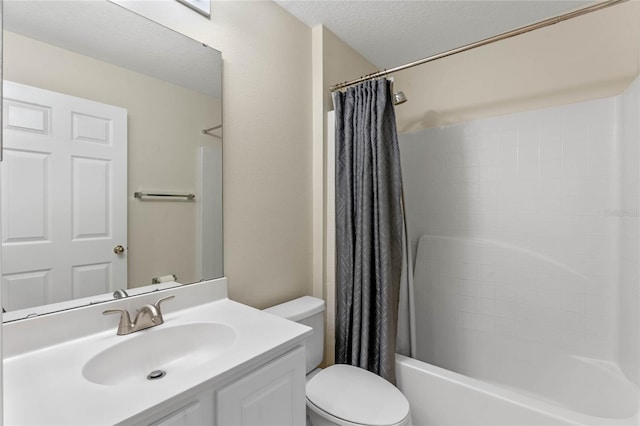 full bathroom featuring vanity, toilet, shower / bath combination with curtain, and a textured ceiling