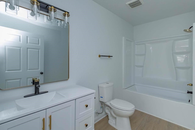 full bathroom featuring shower / tub combination, vanity, toilet, and wood-type flooring