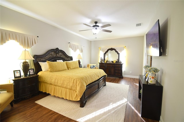 bedroom featuring ceiling fan and dark hardwood / wood-style flooring