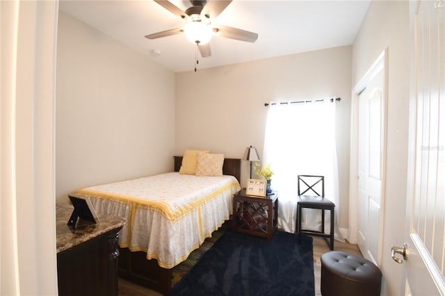 bedroom with hardwood / wood-style floors and ceiling fan