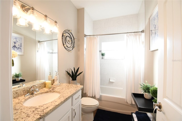 full bathroom featuring vanity, shower / bathtub combination with curtain, and toilet