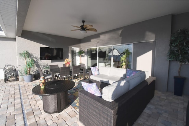 view of patio featuring an outdoor hangout area and ceiling fan