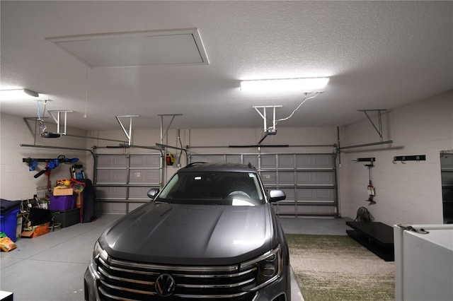 garage featuring a garage door opener