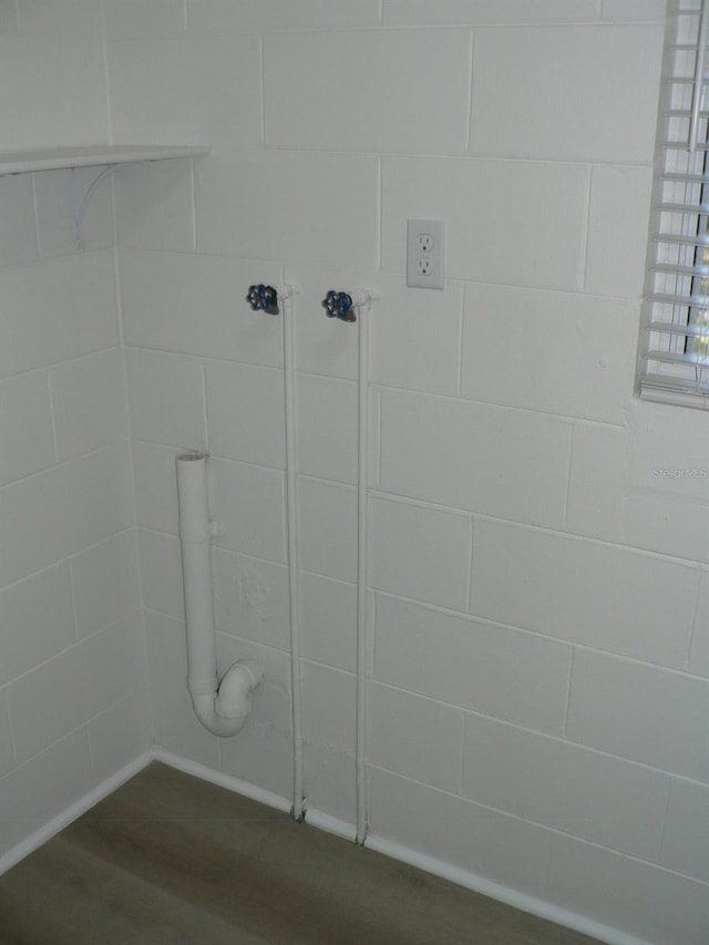 bathroom with hardwood / wood-style floors