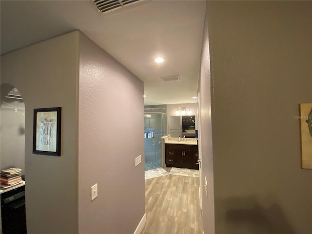 hallway with light wood-type flooring