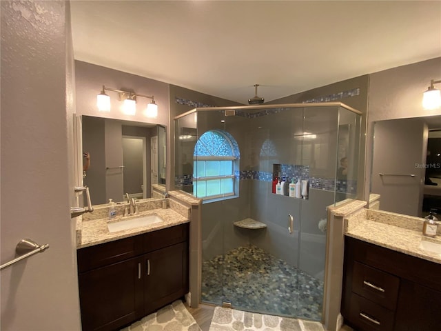 bathroom with vanity and an enclosed shower