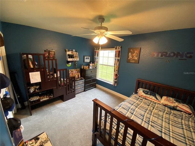 bedroom with ceiling fan and carpet flooring