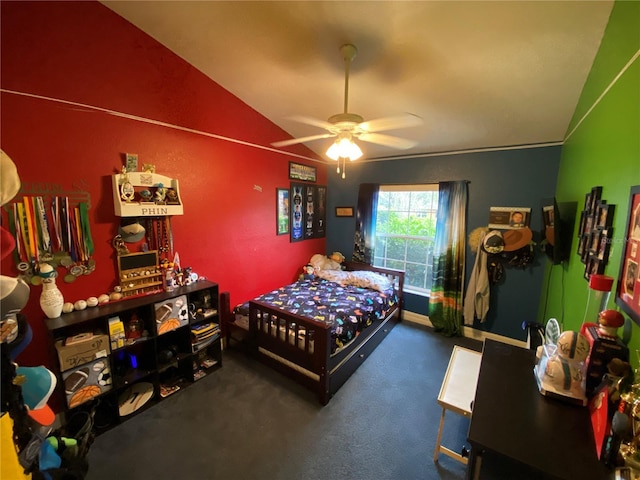 bedroom with dark carpet, vaulted ceiling, and ceiling fan