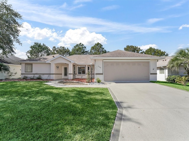 single story home featuring a garage and a front lawn