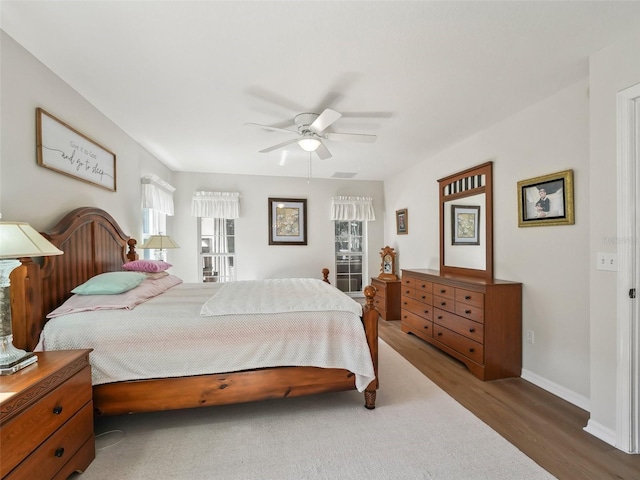 bedroom featuring dark wood-type flooring and ceiling fan