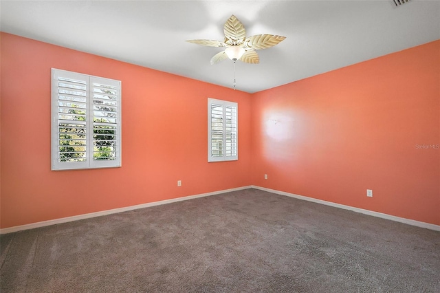 carpeted empty room with ceiling fan