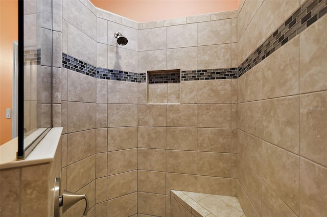 bathroom featuring tiled shower