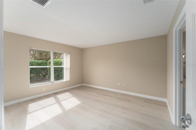 empty room with light wood-type flooring