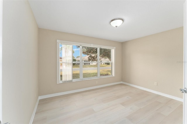 empty room with light hardwood / wood-style floors