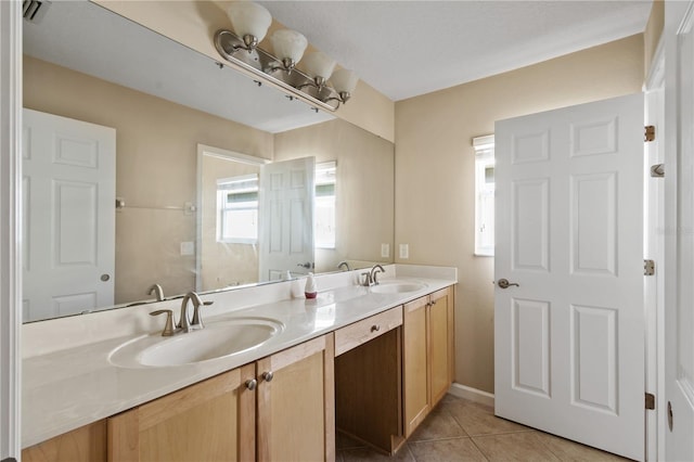 bathroom with tile patterned flooring and vanity