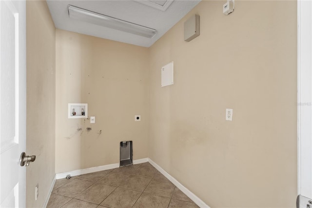 laundry area featuring electric dryer hookup, light tile patterned floors, and hookup for a washing machine