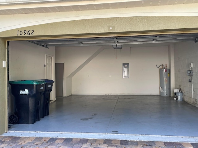 garage with electric panel and water heater