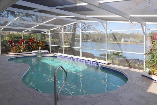 view of pool with a patio area, a water view, and glass enclosure