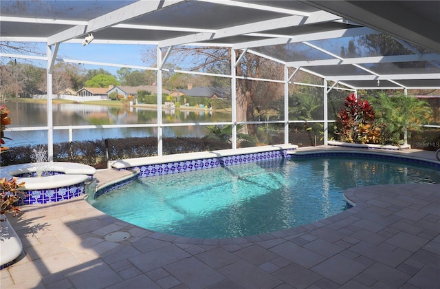 view of pool with a patio area, a water view, and glass enclosure