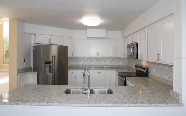 kitchen with white cabinetry, appliances with stainless steel finishes, and sink