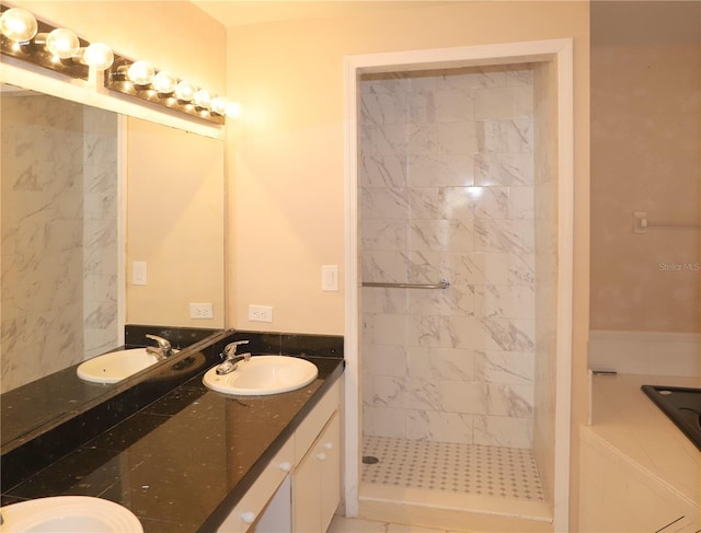 bathroom featuring vanity and a tile shower