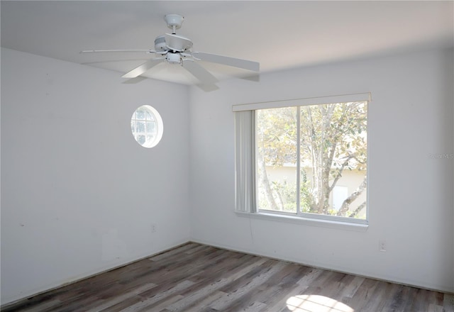 unfurnished room with wood-type flooring and ceiling fan