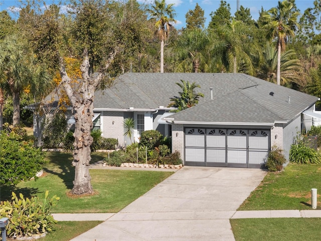 view of front facade featuring a garage and a front lawn