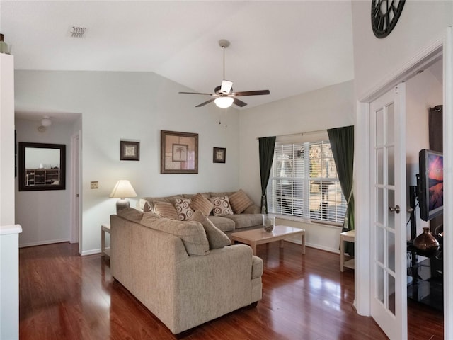 living room with ceiling fan, dark hardwood / wood-style flooring, and vaulted ceiling