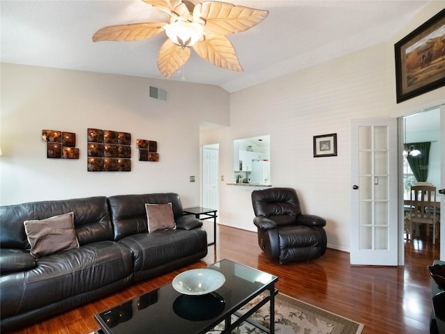 living room with dark hardwood / wood-style flooring, lofted ceiling, french doors, and ceiling fan