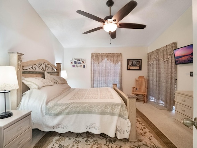 carpeted bedroom with lofted ceiling and ceiling fan