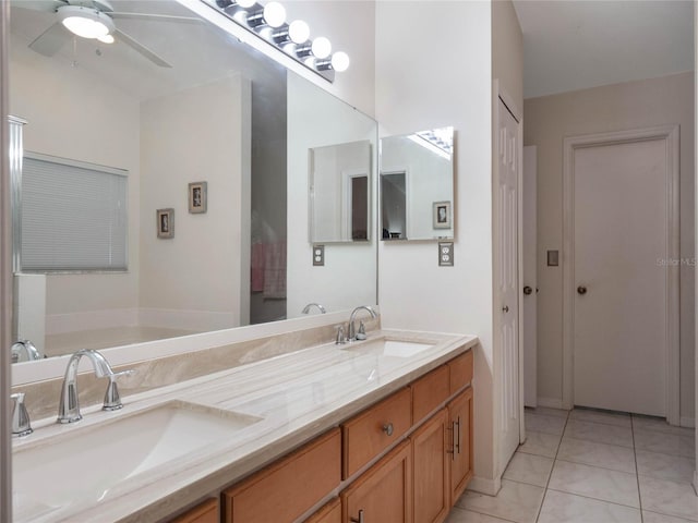 bathroom with vanity, a bathtub, tile patterned flooring, and ceiling fan