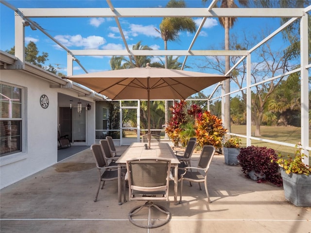 view of patio featuring a lanai