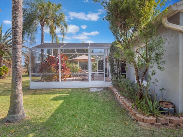 view of yard featuring glass enclosure