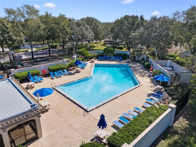 view of swimming pool with a patio area