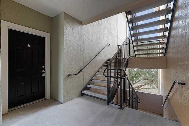 stairway with concrete floors