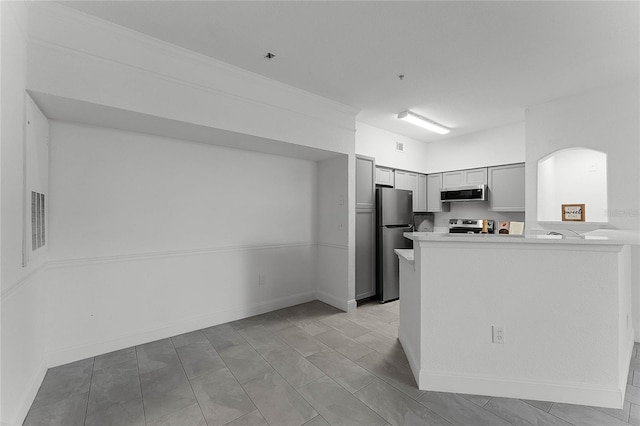 kitchen featuring stainless steel appliances and kitchen peninsula