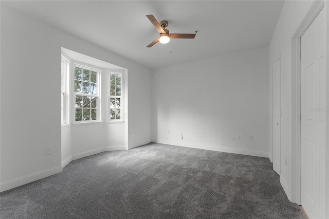 carpeted empty room with ceiling fan