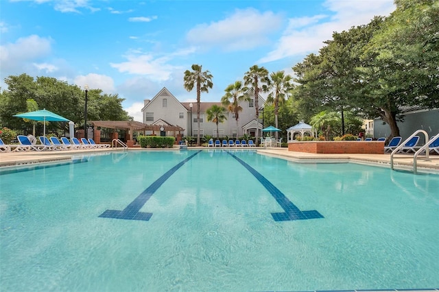 view of swimming pool featuring a gazebo and a patio area