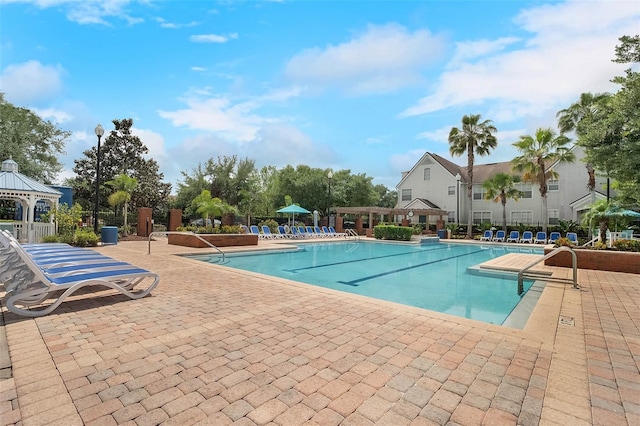 view of pool featuring a patio area