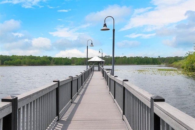 dock area with a gazebo and a water view